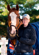 Photo of blog author with a chestnut-colored  horse